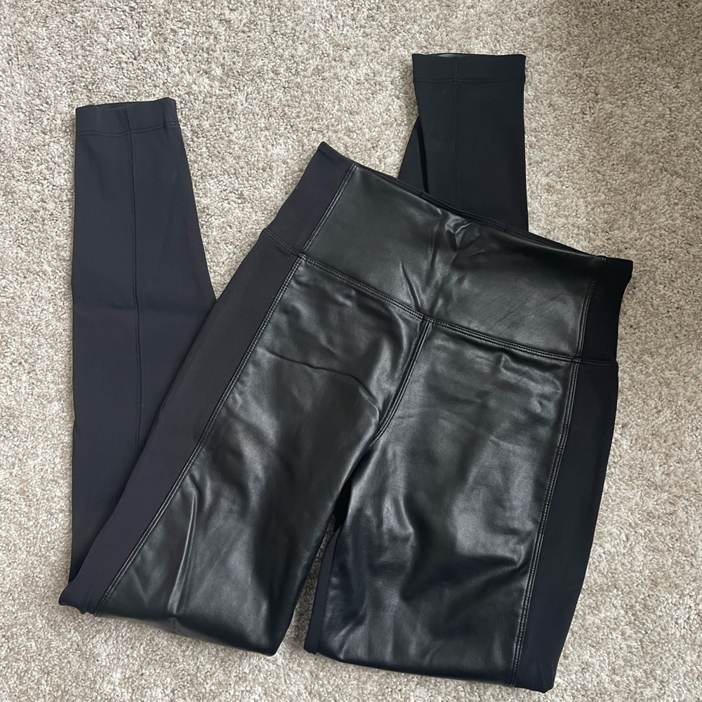 Never worn Athleta leggings with leather detail. Size extra small